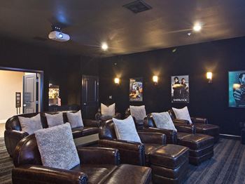 a media room with leather couches and a tv at Century Baxter Avenue, Louisville